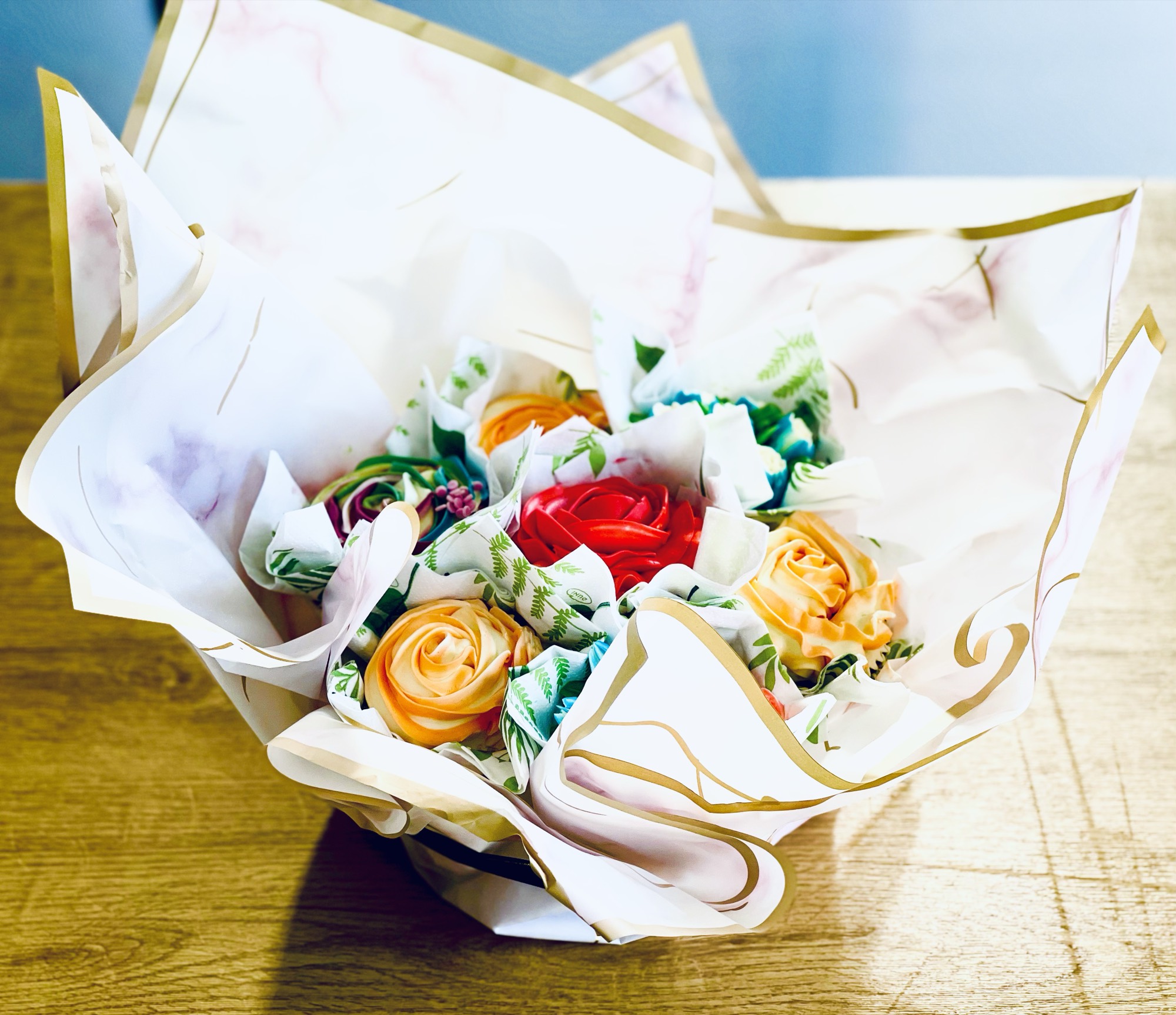 Cupcake bouquet wrapped in marbled paper